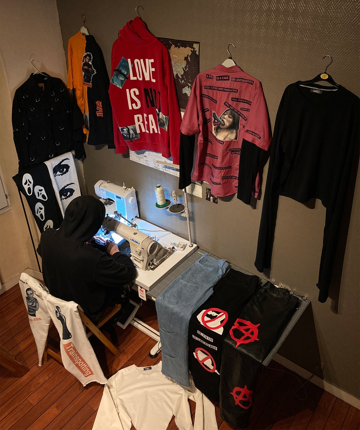 00timeleft in his studio surrounded by handmade clothes