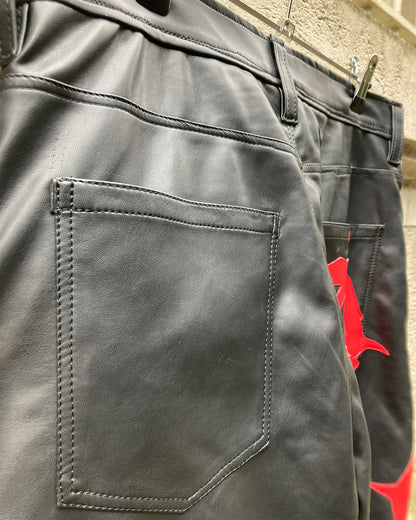 detail view of the back pocket of the anarchy pleather pants