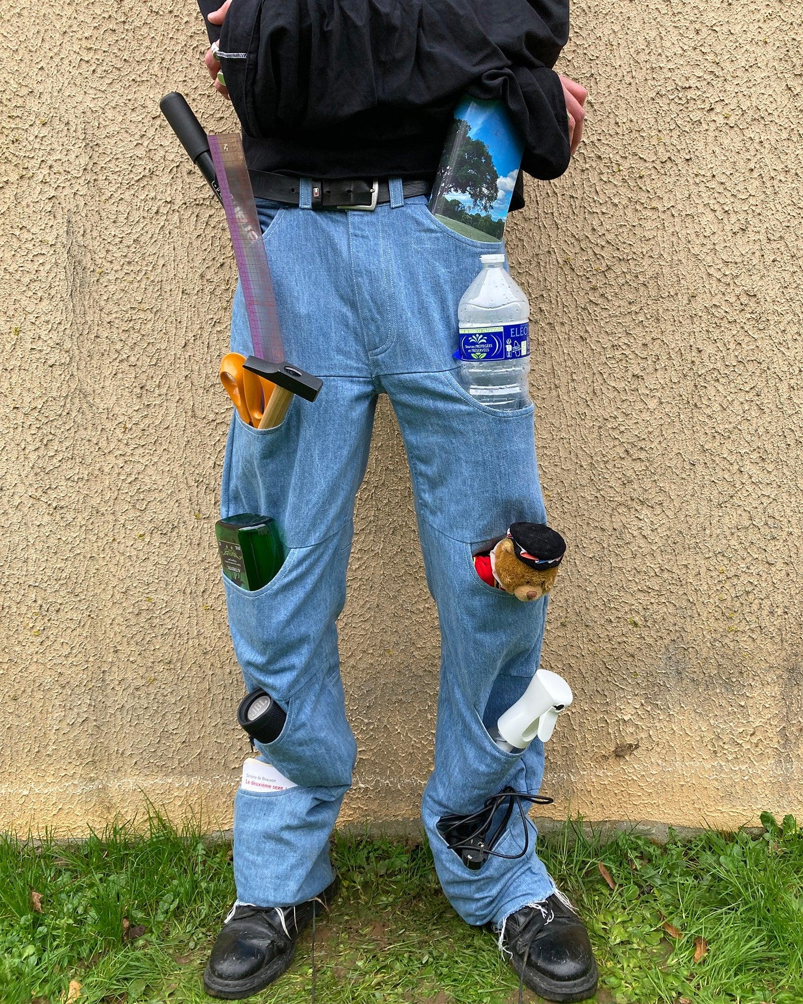 Unlimited Space Jeans worn by a model - The 10 front pockets are filled with random objects.