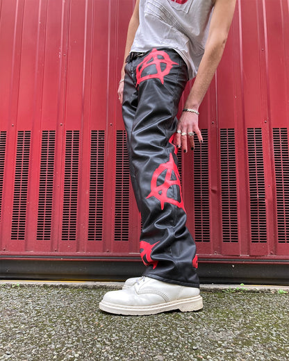 side view of the anarchy pleather pants worn by a model