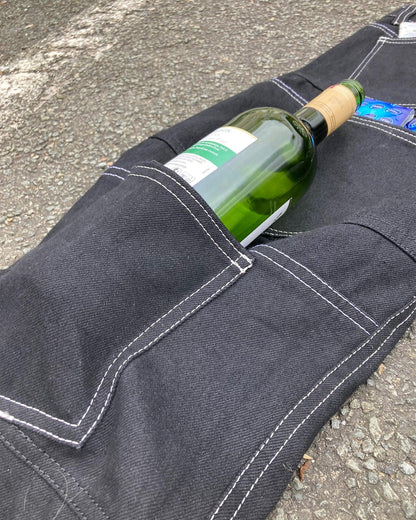 Wine bottle in the back pocket of the Unlimited Space Orijeans 